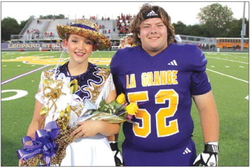 La Grange High School drill team member Savannah Bretz, left, was named Leopardette Sweetheart prior to Friday’s game as part of the homecoming festivities. She is shown here with senior football player Austin Williams, who presented her with her award. Photos by Jeff Wick