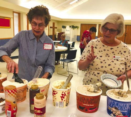 Fayette County Retired Teachers Association members Sandra Aschenbeck and Joan Miertschin enjoy ice cream.