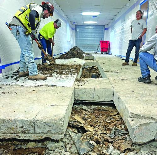 A scene Wednesday in one of the main hallways at La Grange High School as work continues to remedy serious bathroom problems. Photo by Jeff Wick