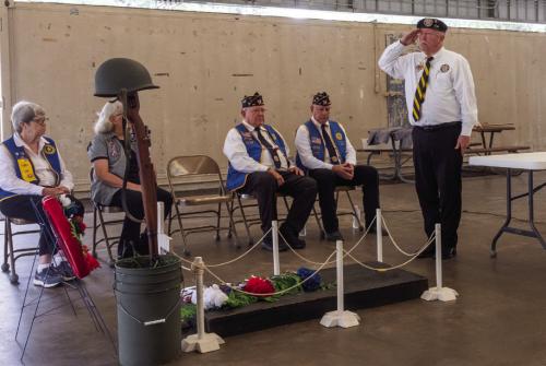 Andy Janda of Vietnam Veterans of America Chapter 870 salutes a memorial to fallen service members at the Schulenburg Memorial Day Service on Monday. Photo by Andy Behlen