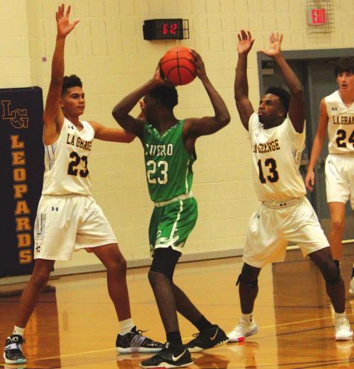 La Grange’s Nate Scott, left, and Dana Baker, right, double team this Cuero player in Tuesday’s game. Photo by Jeff Wick