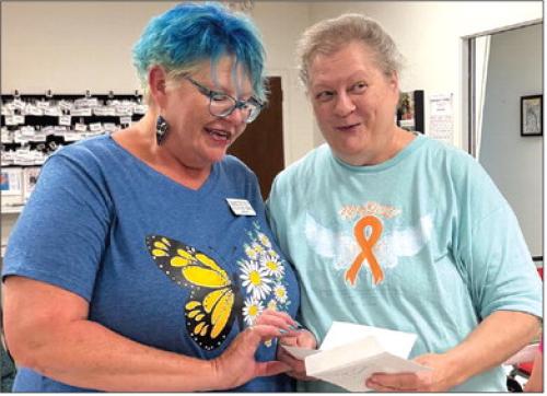 The lovely Deannie Crim with Schulenburg Family Fitness awarded Cathy Besetzny with $20 for a blackout prize. Can you see her surprise?