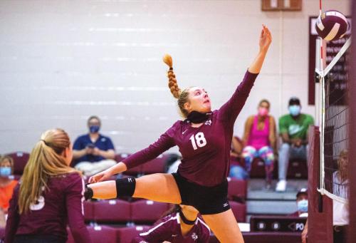 Karli Siptak makes an acrobatic move on the front row for the Flatonia Lady Bulldog volleyball team in Tuesday’s victory over Ganado. Photo by Stephanie Steinhauser