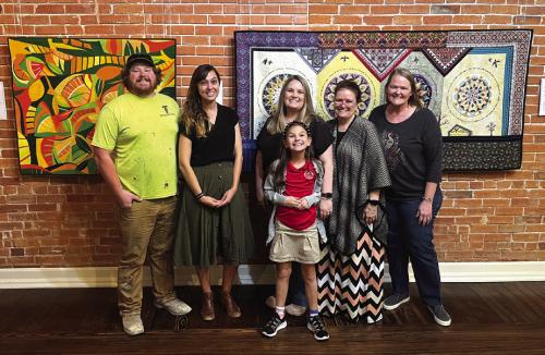 Performers take a break from rehearsal at The Texas Quilt Museum Thursday for this photo. From left to right: Brandon Theut, Jenny Townzen, Tanya Tousek and her daughter Bailey, Regina Keilers and director Heather Barthelme. Not pictured Jeff Wick (because he was taking the photo).