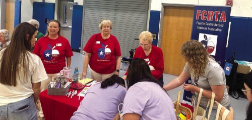 Teachers signing up for more information on FCRTA.