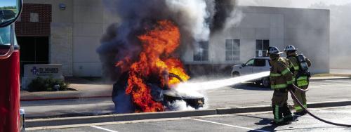 La Grange Fire Chief Frank Menefee and Asst. Chief Todd Johnson attack the flames with a stream of water. Photo by Andy Behlen