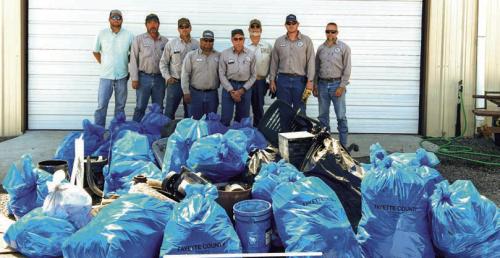 Pct. 4 Commissioner Drew Brossmann and his road and bridge crew picked up dozens of bags of trash along the county roads in Precinct 4 on Tuesday, March 25. Pictured (from left) are Brossmann, David Kunschick, David Osina, Pete Garcia, Jr., Frankie Osina, Mike Fiedler, Josh Morgan and Randy Wick.
