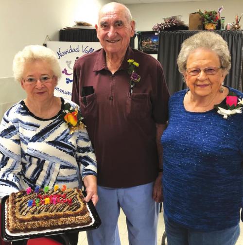 Helen Ohnheiser, holding cake, Allen Hoelscher and Irene Janda.