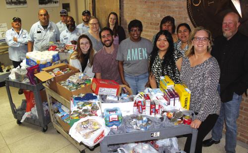 City of La Grange employees recently held a canned food drive for the AMEN food pantry. The various city departments all competed to see which could donate the most food. The winning department got treated to breakfast. The winner was the EDC/Main Street department. In all, the city collected 664 pounds of food, which was donated to AMEN Monday. Shown here are city employees with the food prior to taking it to AMEN. Photo by Jeff Wick
