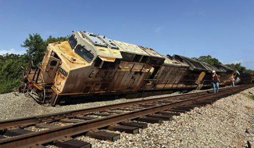 About a dozen rail cars and two Union Pacific locomotives derailed near the Fayette Power Project Monday morning. No one was injured.