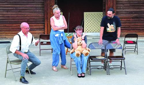 A photo from rehearsal with the cast from left to right: Aaron Rainey, Melissa Weltner, Blythe Cone, and Anthony Lira.