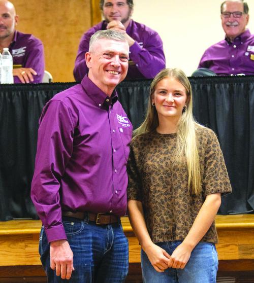 Sophie Vinklarek, right, received the cooperative’s Luck of the Draw Scholarship. She is pictured with FEC general manager and CEO, Doug Lambert.