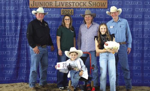JUNIOR SHOWMANSHIP POULTRY– BENJAMIN GARLICK, LA GRANGE 4-H, $7,449 Buckle Sponsor – Stoelke Family Buyers: Todd and Raegan Fritsch – Giddings Livestock, Kelly Joy – The Falls, and Paul Sorensen – Sandy Creek Ranch, Paul and Stacia Sorensen Benjamin Garlick and Reisy Janca – holding bird 