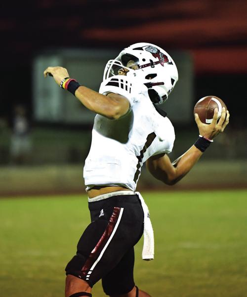 Senior Quarterback Fidel Venegas throws to Keyshaun Green in the second half of Friday night’s season opener in Shiner against the St. Paul Cardinals. Photos by Stephanie Steinhauser