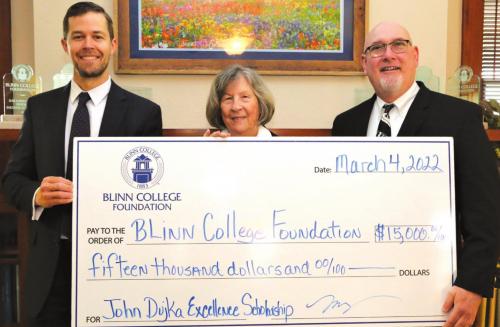 Larry and Mary Whigham have established an endowed scholarship honoring longtime Blinn College music professor John Dujka, gifting $15,000 to the Blinn College Foundation. Pictured are (from left) Sam Sommer, chair of the Foundation Board of Directors; Mary Whigham; and Dujka.