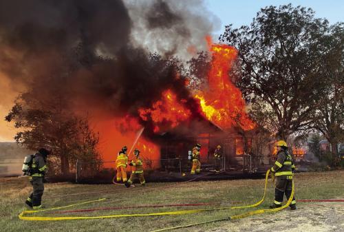 Firefighters at the scene of Monday’s fire.