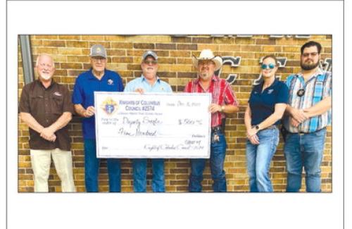 The Knight of Columbus Chromcik Council No. 2574, La Grange, Volunteer Work Group No. 4, made a donation of $500 to the Deputy Santa Program. Presenting the check were three volunteers from Work Group No. 4, Rusty Freedman, Steve Seberger, and Glen Weyand. Receiving the check were Lt. David Beyer, Angela Lala and Jeremy Castleberry.