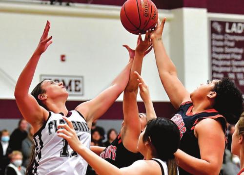 Flatonia’s Ellie Fike, left, battles for a rebound against a pair of Schulenburg players Tuesday. Photo by Stephanie Steinhauser
