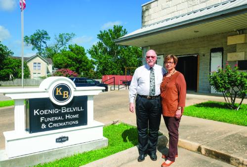 John and Rowena Belvill, owners of Koenig-Belvill Funeral Home in La Grange, stand outside the new funeral chapel under construction. The Belvills said the new chapel is needed to accommodate the tremendous growth their business has experienced recently. Photo by Andy Behlen
