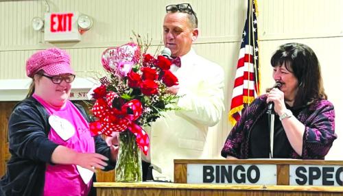 Shayleigh Staal was the winner of the costume contest last Saturday at the Ellinger Valentine Bingo. Pictured also are Michael Schlabach and Paula Urban.