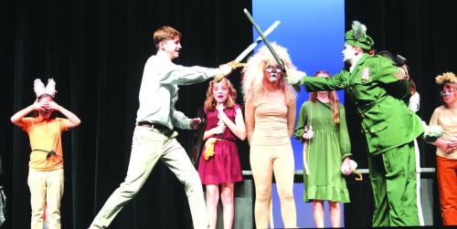 Deacon Wick (Peter) fights Hanna Garza (Fenris Ulf) as other cast members look on.