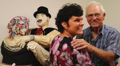 George Kana Jr. and his daughter Lisa dance alongside wooden dancing couple that George’s father and family members constructed for an Armistice Day parade in 1939. The wooden dancers are currently on display at the Fayette Public Library in La Grange.