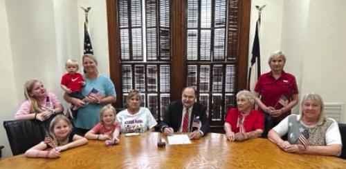 Fayette County Judge Dan Mueller signed a proclamation on June 2 proclaiming Flag Day for KJZT Society No. 65 Pictured front from left: Paisley Guentert, Harper Guentert, secretary Ann Marie Dobecka, Judge Mueller, president Janie Neiser, treasurer Linda Besetzny; back row: Bodie Guentert held by Rachel Guentert and vice-president Lori Leer.