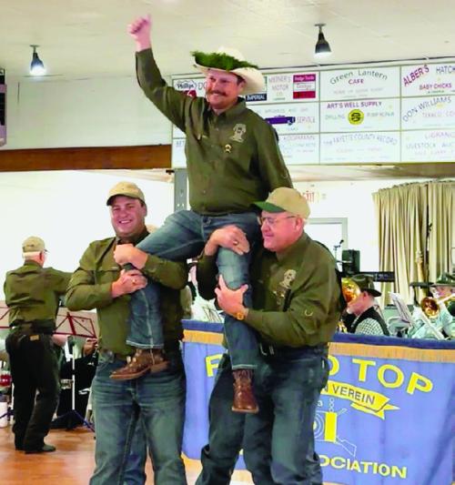 Cullen and Dave Weishuhn carried the new Schützenkönig, Judson Limmer, at the Round Top Schützenfest on Sept. 21