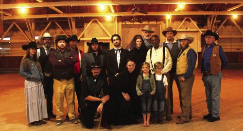 Cast members of “The Man Who Shot Liberty Valance” which will be shown at the Fair Pavilion in La Grange this weekend. Left to right: Front row – Garrett Reavis, Emily Hudson, Lucy Martin, Judah Martin; Back row: Layelah Martin, Will Martin (assistant director), Brandon Theut, Kyle Hartmann (director), Austin Williams, Caleb Parks, Melanie Lira, Doug Forrest, Gregory Rhodes, Jeff Wick, Judd Ulrich, Steve Wynne.