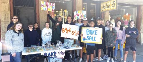All of the La Grange 8th grade home room classes are working on special community service projects this semester. Mrs. Little’s homeroom decided to raise money to help rebuild the Hostyn church which was destroyed in a gas explosion last summer. Here those students are shown at their bake sale last Saturday. Photo by Jeff Wick