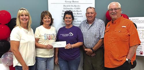 Hermann Sons Life, Plum, recently made a donation to Gardenia E. Janssen Animal Shelter. Pictured (l to r): Kim Bartos, GJAS Board Treasurer, Jackie Wessels, HSLP Secretary, Teresa Brown, GJAS Ex. Dir., Wilbert Hoffman, HSLP President, and Frank Reichert, GJAS Board President