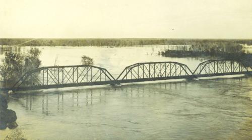 Photograph of the MKT railroad bridge across the Colorado River at La Grange on the evening of Dec. 5, 1913. Photo ourtesy of the Fayette Heritage Museum and Archives