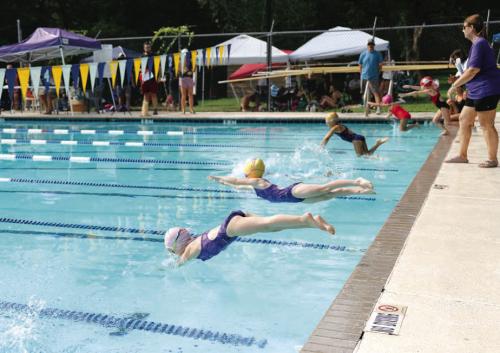 FAST youngsters jump into the pool during a recent race. Photo by Brittany Dawson