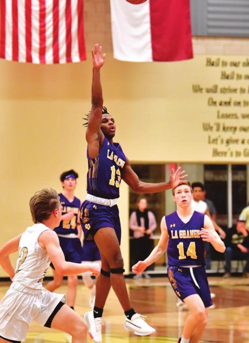Dana Baker was the lone senior on this year’s Leps basketball team. He is shown here making a buzzer-beating three-pointer at the end of a quarter against Giddings in the regular season finale. Photo by Stephanie Steinhauser