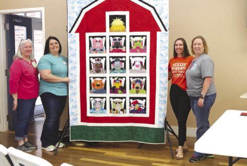 Guild Donates Quilt to Animal Shelter