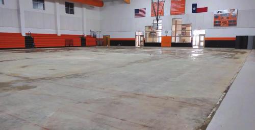 The gym floor at Schulenburg as it looked in late May after the damaged wood flooring was removed after graduation on May 30. At that time there was still moisture under the floor from busted pipes following the February winter storm. Photo courtesy of Duane Limbaugh