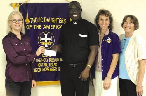 The Hostyn CDA awarded an Audrey Belota Memorial Scholarship on their behalf to Fr. Felix Twumasi. Fr. Felix is continuing his education at the University of Virginia in Charlottesville. Presenting the funds were officers from left: Treasurer Clara Smith, Regent Brenda Fietsam and Recording Secretary Bernadette Muras. Not present for the picture were Vice Regent Lori Kallus and Financial Secretary Donna Rebecek.