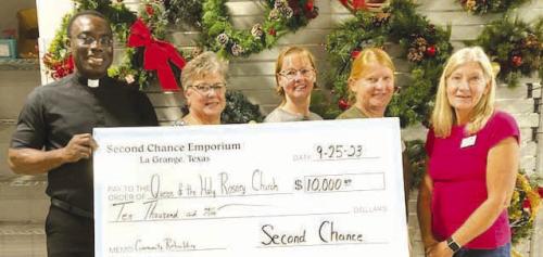 Second Chance Emporium (SCE) recently donated $10,000 to the Queen of the Holy Rosary Church. These funds represent a community rebuilding grant for the Catholic Church in Hostyn. Pictured (from left) are Father Felix Twumasi and Edith Zapalac, Queen of the Holy Rosary Church; Nancy Hajek, SCE Church Coordinator; Marlene Schnell, SCE Assistant Store Director and Gayle Schielack, SCE Store Director.