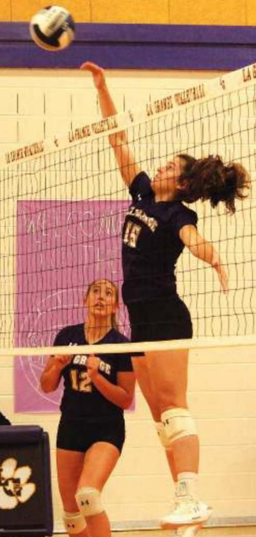 Ryann Marshall spikes a ball in Saturday’s match.