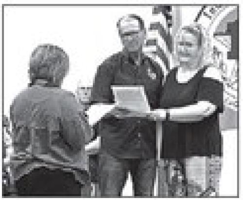 School Board Inductions Calvin Mersiovsky and Dr. Karen Roberts are sworn in Monday after being re-elected to the school board.