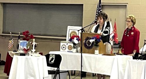 Paula Urban and Angie Pavlicek presenting the premise of the POW/MIA table.