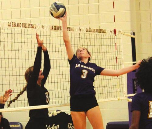 La Granges Hailey Hill tips the ball at the net in action Tuesday at home against East Bernard. Photo by Jeff Wick