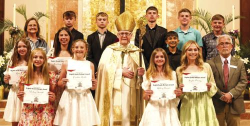 Bishop Presents Awards to St. Rose 8th Graders
