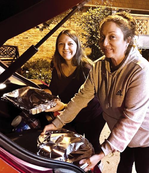 St. James Holy Smokers Cook For Area Families