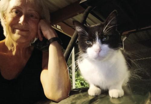 Jeri Welter and her cat Buddy, who she found after he was missing for 100 days in La Grange.