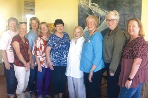 Members of the Fayette County Retired Teachers Association flank presenter Suzanne Batchelder, fourth from the right.