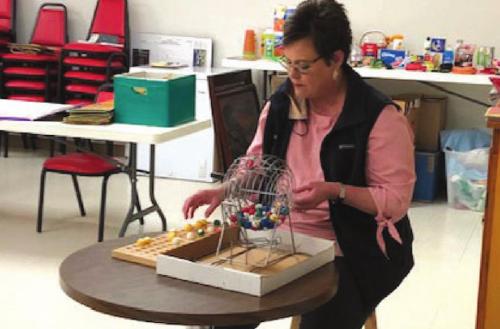 Cheryl Brossman, from Fayette Savings Bank, calling Bingo at the Center last week.
