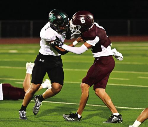 Flatonia’s Freddy Manzano faces off with a Bloomington Bobcat in Friday’s district win. Photo by Stephanie Steinhauser