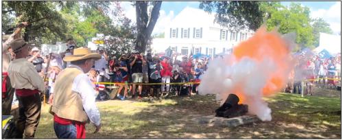 The Civil War-era cannon on the courthouse grounds roars to life, signaling the start of the parade. The boom can be heard all over the town. Photos by Jeff Wick