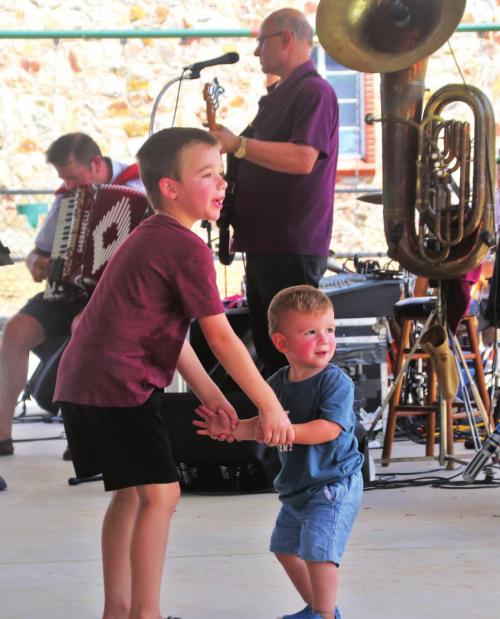 A pair of youngsters dance to the music of Mark Halata and Texavia at the Plum Feast. Photo by Gary E. McKee/Texas Polka News